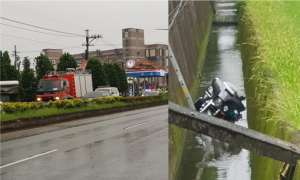 疑天雨路滑 機車騎士摔落台1線旁排水溝